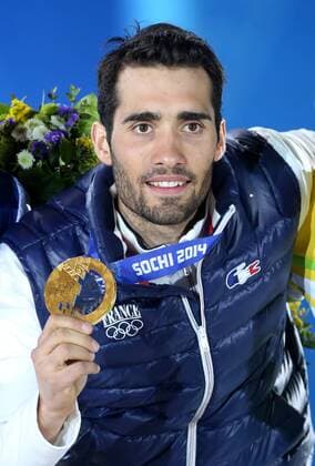OLYMPIA - Olympische Spiele 2014 SOTSCHI,RUSSLAND,14.FEB.14 - DIVERS, OLYMPIA, BIATHLON- Olympische Winterspiele Sotschi 2014, Siegerehrung, Medaillenvergabe am Medal Plaza, 20km Einzel der Herren. Bild zeigt Martin Fourcade (FRA). Keywords: Medaille. 