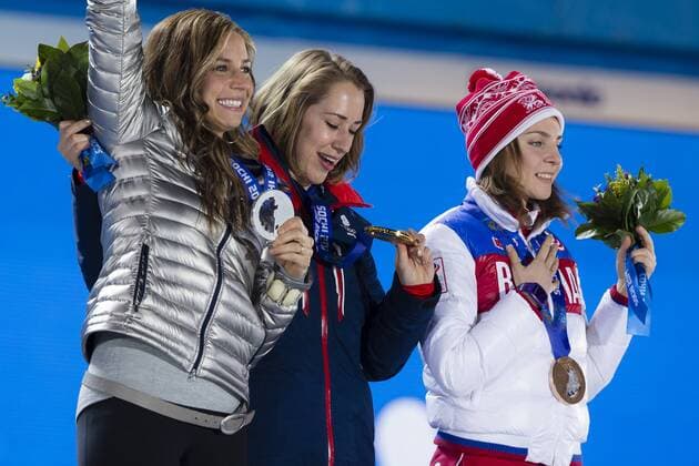 15.02.2014 Sochi, Krasnodar Krai, Russia. A tearful Lizzy YARNOLD (GBR) (centre) (flanked by Noelle PIKUS-PACE on left &amp; Elena NIKITINA on right) can t stop looking at her Gold medal during the Medal Ceremony for the Women s Skeleton at the Sochi Medals Plaza, Coastal Cluster - XXII Olympic Winter Games xCraigxMercerx  ActionPlus20172925