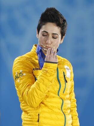(140215) -- SOCHI, Feb. 15, 2014 (Xinhua) -- Bronze medalist Lydia Lassila of Australia kisses the medal during the awarding ceremony for the ladies aerials final of freestyle skiing at the 2014 Sochi Winter Olympic Games in Sochi, Russia, Feb. 15, 2014. (Xinhua Wang Lili) (SP)OLY-RUSSIA-SOCHI-FREESTYLE SKIING-LADIES AERIALS FINAL 