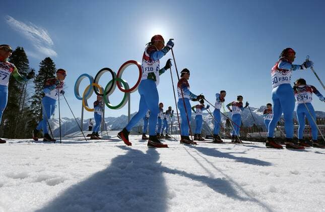 Feb. 15, 2014 - Sochi, Russia - Fore runners gather around the Olympic rings before the start of the Ladies 4 x 5km Relay Laura Cross-Country Ski & Biathlon Center at the 2014 Sochi Winter Olympics. Sweden won the gold medal. Women s Cross Country - Sochi 2014  - ZUMA Co