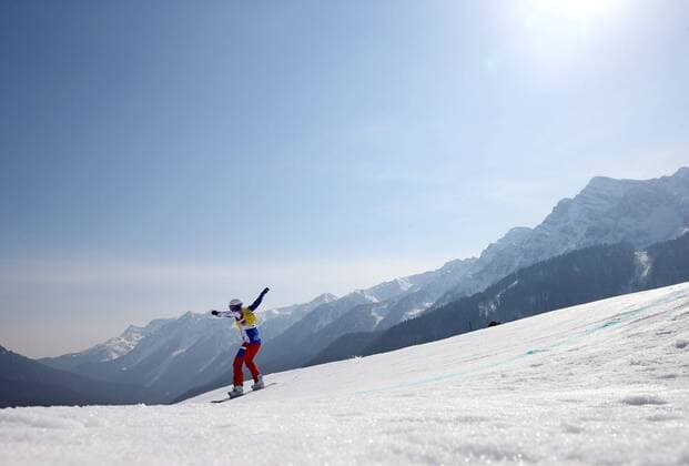 Feb. 16, 2014 - Sochi, RUS - A snowboarder competes in quarterfinals of the women s snowboard cross at the Rosa Khutor Extreme Park during the Winter Olympics in Sochi, Russia, Sunday, Feb. 16, 2014. Women s Snowboard Cross - ZUMAm67