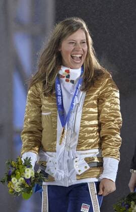 Czech Republic s Eva Samkova smiles after receiving her gold medal during the victory ceremony for ladies snowboard-cross at the Sochi 2014 Winter Olympics on February 16, 2014 in Sochi, Russia.  OLY20140216165