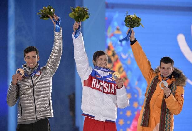 United States Matthew Antoine, Russia s Alexander Tretiakov and Latvia s Martins Dukurs celebrate their bronze, gold and silver medals respectively during the victory ceremony for men s skeleton at the Sochi 2014 Winter Olympics on February 16, 2014 in Sochi, Russia.  OLY20140216731