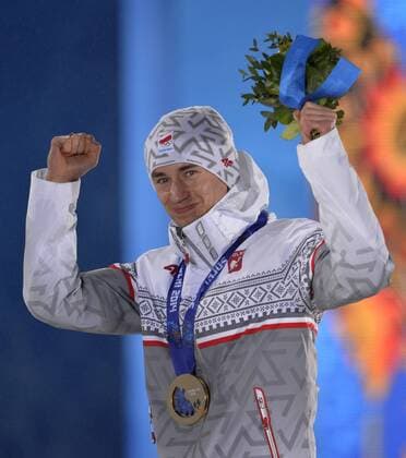 Poland s Kamil Stoch celebrates with his gold medal during the victory ceremony for ski jumping men s large hill individual at the Sochi 2014 Winter Olympics on February 16, 2014 in Sochi, Russia.  OLY20140216737