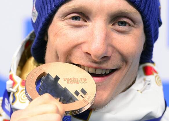 Medalist in the men s biathlon 15K mass start, Czech Republic s Ondrej Moravec poses with his bronze medal at the 2014 Winter Olympics in Sochi, Russia, Tuesday, February 18, 2014. (CTKxPhoto RomanxVondrous) CTKPhotoP201402180958601 
