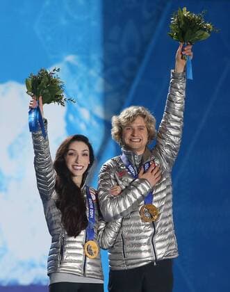 Sochi, Krasnodar Krai, Russia - USA s Figure Skating Ice Dance Free Dance Gold medalists Charlie WHITE and Meryl Davis(middle) enter the stage to accept their Gold medals duirng the Winter Olympics on February 17 in Sochi, Russia. Figure Skating - Sochi 2014 - ZUMAa35