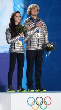 Sochi, Krasnodar Krai, Russia - USA s Figure Skating Ice Dance Free Dance Gold medalists Charlie WHITE and Meryl Davis(middle) enter the stage to accept their Gold medals duirng the Winter Olympics on February 17 in Sochi, Russia. Figure Skating - Sochi 2014 - ZUMAa35