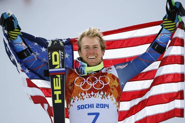 Feb. 19, 2014 - Sochi, Russia - TED LIGETY of the USA holds up the national flag during the flower ceremony after winning the gold medal at the Men s Giant Slalom Rosa Khutor Alpine Center at the 2014 Sochi Winter Olympics. Men s Alpine - Sochi 2014  - ZUMA- S