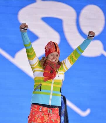 Germany s Viktoria Rebensburg celebrates during the victory ceremony for ladies alpine skiing giant slalom at the Sochi 2014 Winter Olympics on February 19, 2014 in Sochi, Russia. Rebensburg won a bronze medal in the event.  OLY20140219116