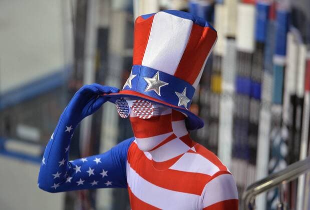 A USA fan adjust his hat prior to the U.S.A. s men s quarterfinal hockey game at the Sochi 2014 Winter Olympics on February 19, 2014 in Sochi.  OLY20140219328