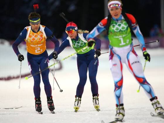 ITAR-TASS: SOCHI, RUSSIA. FEBRUARY 19, 2014. Ole Einar Bjoerndalen (L) and Tiril Eckhoff of Norway compete to gold in the mixed biathlon relay event at the Laura Ski Centre at the 22nd Winter Olympic Games.  RE13A376