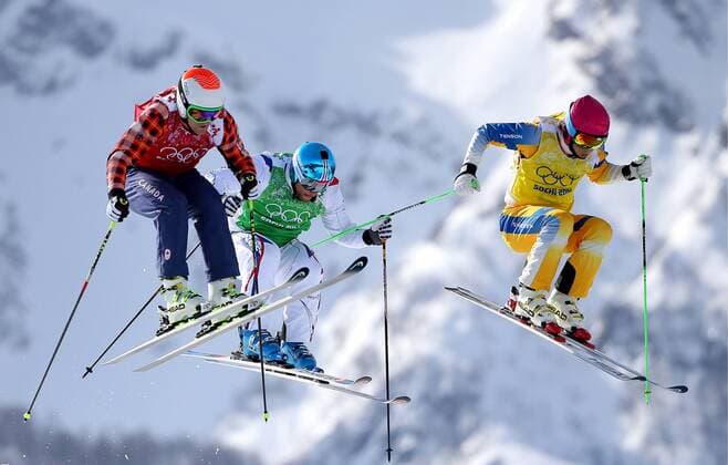 ITAR-TASS: SOCHI, RUSSIA. FEBRUARY 20, 2014. Brady Leman of Canada, Arnaud Bovolenta of France and John Eklund of Sweden (L-R) compete in the Men s Ski Cross event at Rosa Khutor Extreme Park during the 22nd Winter Olympic Games in Sochi.  Aufmacher 1802