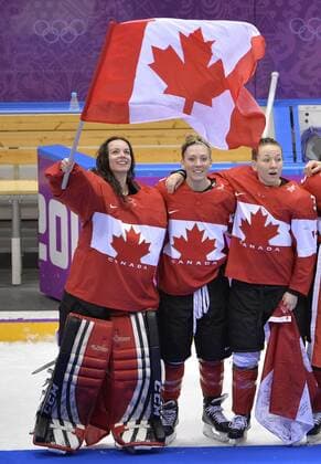 Canada s Shannon Szabados (L-R), Meghan Agosta and Jocelyne Larocque celebrate after defeating the United States to win the women s ice hockey game at the Sochi 2014 Winter Olympics on February 20, 2014 in Sochi, Russia. Canada won 3-2 in overtime.  OLY20140220158