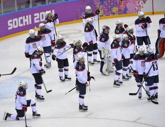 The United States watches as Canada celebrates after winning the women s ice hockey game at the Sochi 2014 Winter Olympics on February 20, 2014 in Sochi, Russia. Canada won 3-2 in overtime.  OLY20140220151