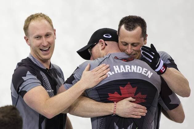 21.02.2014 Sochi, Krasnodar Krai, Russia. Canada s Ryan HARNDEN gets a pat on the back from skip Brad JACOBS &amp; hug from brother E.J. HARNDEN during the Gold Medal Game of the Men s Curling competition from the Ice Cube Curling Centre, Coastal Cluster - XXII Olympic Winter Games xCraigxMercerx  ActionPlus20177030