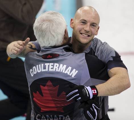 21.02.2014 Sochi, Krasnodar Krai, Russia. Canada vice-skip Ryan FRY hugged by Coach Tom COULTERMAN after GB concede defeat during the Gold Medal Game of the Men s Curling competition from the Ice Cube Curling Centre, Coastal Cluster - XXII Olympic Winter Games xCraigxMercerx  ActionPlus20177037