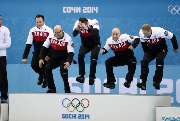 (140221) -- SOCHI, Feb. 21, 2014 (Xinhua) -- Players of Canada celebrate during the flower ceremony after the men s gold medal game of Curling between Canada and Great Britain at the 2014 Sochi Winter Olympic Games in Sochi, Feb. 21, 2014. Canada won 9-3 and claimed the gold medal of the event. (Xinhua Wang Lili) (SP)OLY-RUSSIA-SOCHI-CURLING-MEN S GOLD MEDAL GAME 