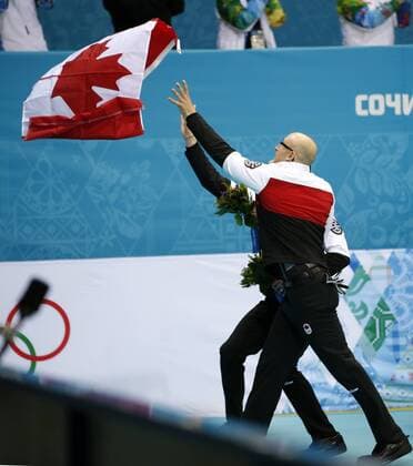 (140221) -- SOCHI, Feb. 21, 2014 (Xinhua) -- Players of Canada celebrate during the flower ceremony after the men s gold medal game of Curling between Canada and Great Britain at the 2014 Sochi Winter Olympic Games in Sochi, Feb. 21, 2014. Canada won 9-3 and claimed the gold medal of the event. (Xinhua Wang Lili) (SP)OLY-RUSSIA-SOCHI-CURLING-MEN S GOLD MEDAL GAME 