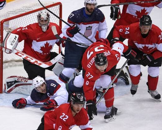 Feb. 21, 2014 - Sochi, RUS - USA forward Zach Parise (9) falls in front of Canada goalie Carey Price (31) in the first period of a men s hockey semifinal at Bolshoy Ice Dome during the Winter Olympics in Sochi, Russia, Friday, Feb. 21, 2014. USA vs Canada Hockey - ZUMAm67