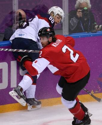 Feb. 21, 2014 - Sochi, RUS - Canada defenseman Duncan Keith (2) hits USA forward Patrick Kane (88) in the first period of a men s hockey semifinal at Bolshoy Ice Dome during the Winter Olympics in Sochi, Russia, Friday, Feb. 21, 2014. USA vs Canada Hockey - ZUMAm67
