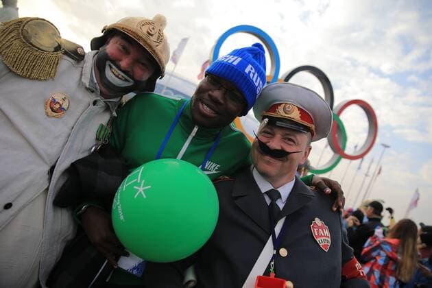 ITAR-TASS: SOCHI, RUSSIA. FEBRUARY 22, 2014. Sports fans wear funny costume in the Coastal Olympic Village during the 22nd Winter Olympic Games in Sochi.  RE13A9DE