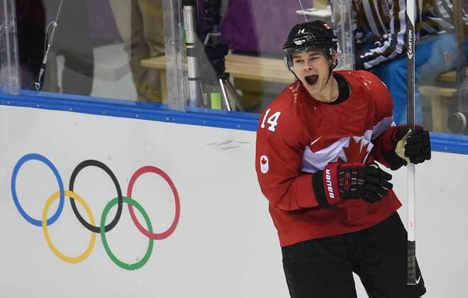 (140223) -- SOCHI, Feb. 23, 2014 (Xinhua) -- Chris Kunitz of Canada celebrates after scoring during the men s gold medal game of Ice Hockey between Canada and Sweden at the 2014 Sochi Winter Olympic Games in Sochi, Russia, Feb. 23, 2014. Canada won 3-0 and claimed the gold medal of the event. (Xinhua Wang Yuguo) (SP)OLY-RUSSIA-SOCHI-ICE HOCKEY-MEN S GOLD MEDAL GAME-SWE VS CAN 