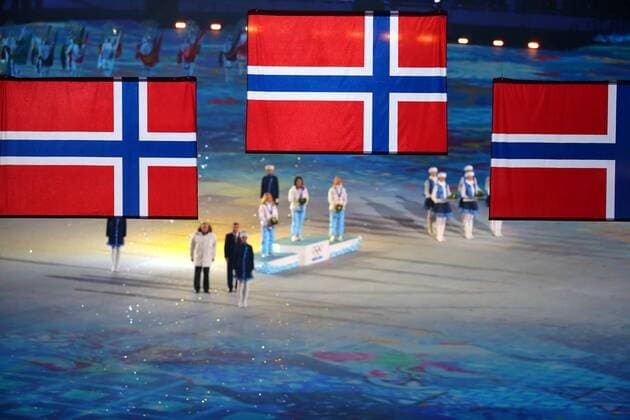 (140223) -- SOCHI, Feb. 23, 2014 (Xinhua) -- Norway national flags are raised during the awarding ceremony for the ladies 30km mass start free of cross-country event at the 2014 Sochi Winter Olympic Games in Sochi, Russia, Feb. 23, 2014. (Xinhua Gong Bing) (SP)OLY-RUSSIA-SOCHI-CROSS COUNTRY-LADIES 30KM MASS START FREE 