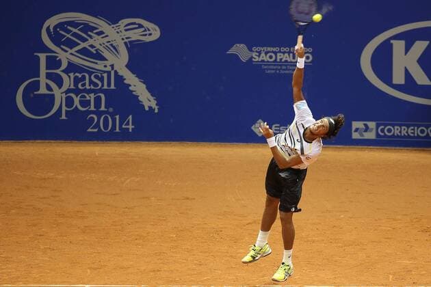 Joao Souza of Brazil serves during the men s singles match at the Brazil Open 2014 tennis tournament, in Sao Paulo, Brazil, on Feb. 24, 2014. (Xinhua RahelxPatrasso) (sp) (SP)BRAZIL-SAO PAULO-TENNIS-BRAZIL OPEN 