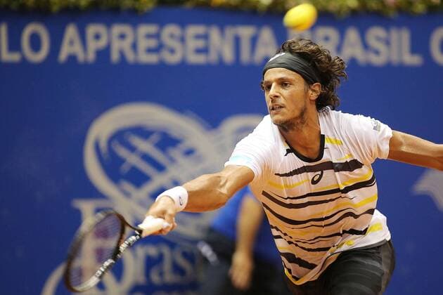 Joao Souza of Brazil hits a return during the men s singles match at the Brazil Open 2014 tennis tournament, in Sao Paulo, Brazil, on Feb. 24, 2014. (Xinhua RahelxPatrasso) (sp) (SP)BRAZIL-SAO PAULO-TENNIS-BRAZIL OPEN 