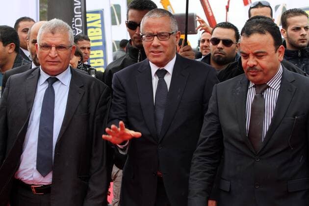 (140226) -- TRIPOLI, Feb. 26, 2014(Xinhua) -- Libyan Prime Minister Ali Zeidan (C) waves as he arrives to attend a ceremony for the laying of a foundation stone of Libyan National Stadium that is to host the 2017 Africa Cup of Nations in Tripoli, Libya, on Feb 26, 2014. (Xinhua Hamza Turkia) LIBYA-TRIPOLI-AFR2017-STADIUM 