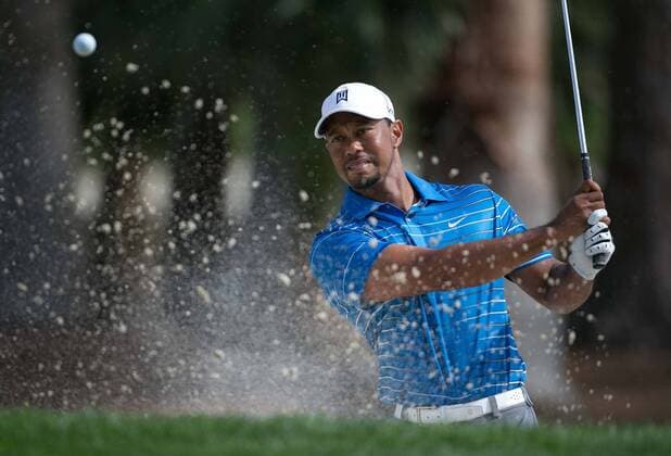 Feb. 27, 2014 - Palm Beach Gardens, FL, USA - Tiger Woods hits out of a trap on the 3rd hole during the first round of the Honda Classic in Palm Beach Gardens, Fla., on Thursday, Feb. 27, 2014. 2014 Honda Classic - ZUMAm67