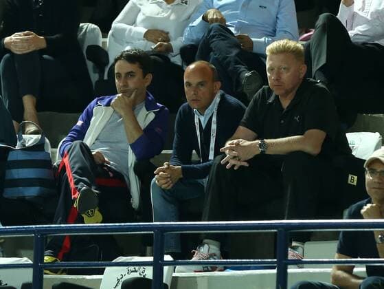Dubai Tennis Championships 2014, ATP Tennis Herren Tennis Turnier,International Series,Dubai Tennis Stadium, U.A.E., Boris Becker,Trainer von Novak Djokovic auf der Tribüne,daneben sitzt Manager Edoardo Artaldi,Querformat,