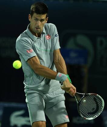 Dubai Tennis Championships 2014, ATP Tennis Herren Tennis Turnier,International Series,Dubai Tennis Stadium, U.A.E., Novak Djokovic (SRB),Aktion,Einzelbild, Halbkörper,Hochformat,