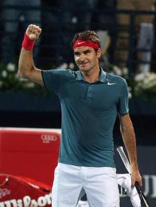 Dubai Tennis Championships 2014, ATP Tennis Herren Tennis Turnier,International Series,Dubai Tennis Stadium, U.A.E., Roger Federer (SUI) macht die Faust und jubelt nach seinem Sieg,Jubel, Freude,Emotion,Einzelbild, Halbkörper,Hochformat,