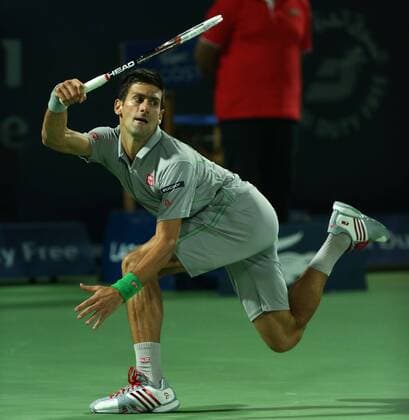 Dubai Tennis Championships 2014, ATP Tennis Herren Tennis Turnier,International Series,Dubai Tennis Stadium, U.A.E., Novak Djokovic (SRB),Aktion,Einzelbild, Halbkörper,Querformat,