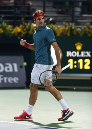 Dubai Tennis Championships 2014, ATP Tennis Herren Tennis Turnier,International Series,Dubai Tennis Stadium, U.A.E.,Final,Endspiel,Roger Federer (SUI) macht die Faust und jubelt,Jubel,Emotion, Einzelbild,Ganzkörper,Hochformat,