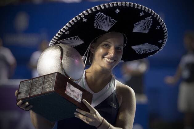 Dominika Cibulkova of Slovakia poses with her trophy after winning her women s singles final match of the Mexican Open tennis tournament in Acapulco, Guerrero, Mexico, on March 1, 2014. (Xinhua AlejandroxAyala) (rt) (fnc) (SP)MEXICO-ACAPULCO-TENNIS-MEXICAN OPEN 