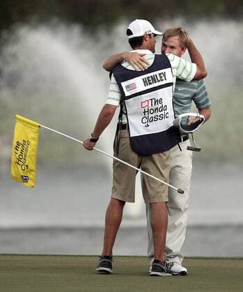 March 2, 2014 - Palm Beach Gardens, FL, USA - Russell Henley, right, hugs his caddy after winning the Honda Classic at Palm Beach Gardens, Fla., on Sunday, March 2, 2014. Honda Classic - ZUMAm67