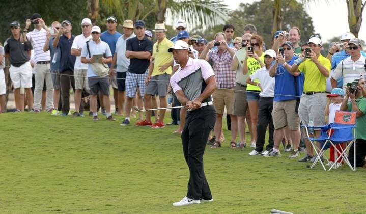 March 5, 2014 - Doral, FL, USA - Fans watch as Tiger Woods hits a practice shot for the WGC-Cadillac Championship on the first hole at the newly designed Trump National Doral in Doral, Fla., on Wednesday, March 5, 2014. Trump National Doral - ZUMAm67