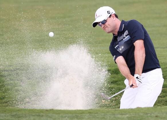 March 6, 2014 - Doral, FL, USA - Zach Johnson hits out of the bunker at the first hole during the first round of the WGC-Cadillac Championship at Trump National Doral in Doral, Fla., on Thursday, March 6, 2014. WGC-Cadillac Championship - ZUMAm67