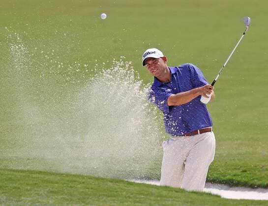 March 6, 2014 - Doral, FL, USA - Bill Haas hits out of the bunker at the first hole during the first round of the WGC-Cadillac Championship at Trump National Doral in Doral, Fla., on Thursday, March 6, 2014. WGC-Cadillac Championship - ZUMAm67