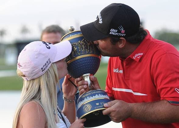 March 09, 2014, Patrick Reed and wife Justine kiss the Trophy after winning the PGA Golf Herren - World Golf Championship - Final Round at Trump National Doral in Doral, Florida GOLF: MAR 09 PGA Golf Herren - World Golf Championships-Cadillac Championship - Final Round Icon20180939 EDITORIAL USE ONLY