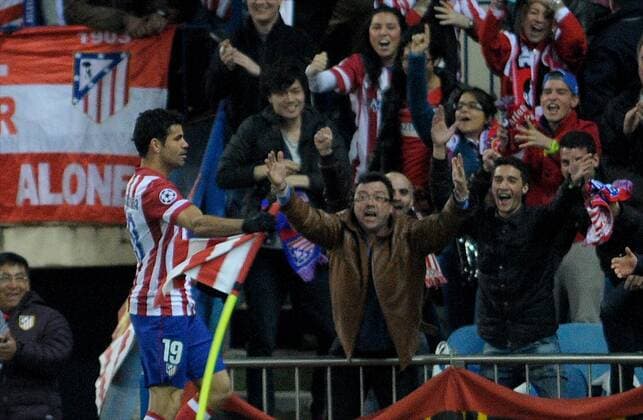 Atletico de Madrid Forward, number 19 DIEGO COSTA - Diego da Silva Costa (24), celebrates after scoring a goal (1-0) during round Round of 16 of the UEFA Champions league, soccer match between Atletico de Madrid at the VicentexCalderon estadium, Madrid - Spain by March 11, 2014. 