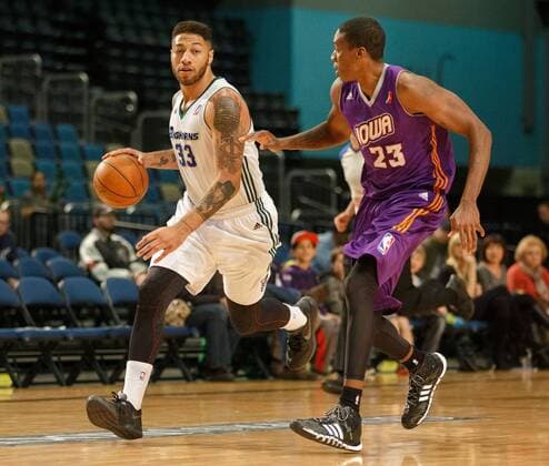 March 12, 2014 - Reno, Nevada, U.S - Reno Bighorn and Sacramento Kings hopeful ROYCE WHITE (33) drives against Iowa Energy LARRY OWENS (23) during the NBA Basketball Herren USA D-League Basketball game between the Reno Bighorns and the Iowa Energy at the Reno Events Center in Reno, Nevada. NBA Basketball Herren USA D-League 2014 - Reno Defeats Iowa 120-110  - ZUMAm13