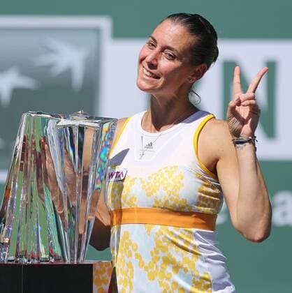 Flavia Pennetta of Italy holds the championship trophy after winning her women s final match at the BNP Paribas Open in Indian Wells, California on March 16, 2014. .  IDW20140316706