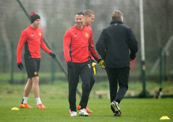 Ryan Giggs of Manchester United smiles during training - UEFA Champions League - Manchester United Training - Aon Carrington Training Complex - Manchester - England - 18th March 2014 - Picture Philip Oldham Sportimage EDITORIAL USE ONLY. No use with unauthorised audio, video, data, fixture lists, club league logos or live services. Online in-match use limited to 120 images, no video emulation. No use in betting, games or single club league player publications.
