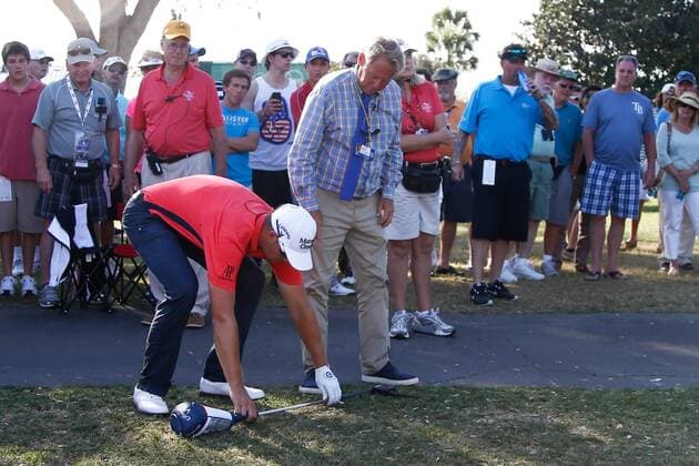 March 20, 2014 - Orlando, Florida, U.S - Henrik Stenson (L) measures his club with a Rules Official on the 18th hole during the first round of the Arnold Palmer Invitational at Bay Hill. Golf 2014 - Arnold Palmer Invitational - Round 1 - ZUMAw10