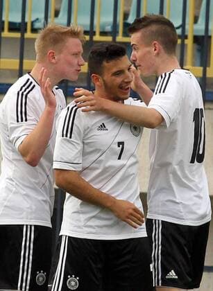 28.03.2014 Belgrade(Serbia) Republic of Ireland-Germany UEFA Under 17 Euro qualifiers elite round men s football Phillipp Ochs(L) with Arianit Ferati(c) and Max Besuschkow(r)Germany celebrate second goal on the match : 