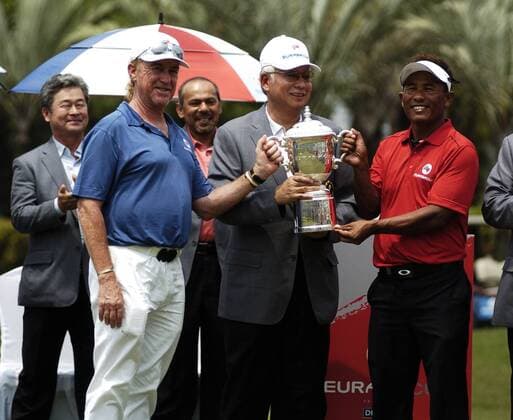 29 March 2014 Kuala Lumpur, Malaysia. Inaugural EurAsia Cup in Kuala Lumpur was a completed remarkable fight by Asia on their last day 10-10. Here is Miguel Angel Jimenez from Spain and Thongchai Jaidee from Thaliand, Captain of Europe and Asia with Prime Minister of Malaysia Datuk Seri Najib Razak. Fatin Rosli HBL Network