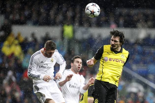 Real Madrid s Daniel Carvajal and Sergio Ramos and Borussia Dortmund s Mats Hummels during Champions League soccer match at Santiago Bernabeu stadium in Madrid, Spain. April 02, 2014.  (20183059)